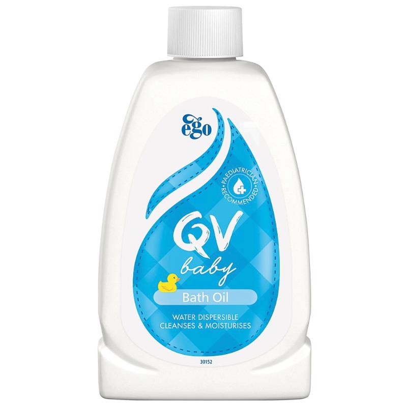 A bottle of QV Baby Bath Oil. The label features a large blue water droplet design with a yellow rubber duck graphic. Text on the label includes ‘Paediatrician recommended,’ ‘WATER DISPERSIBLE CLEANS & MOISTURISES,’ and a product code ‘30152’ at the bottom.