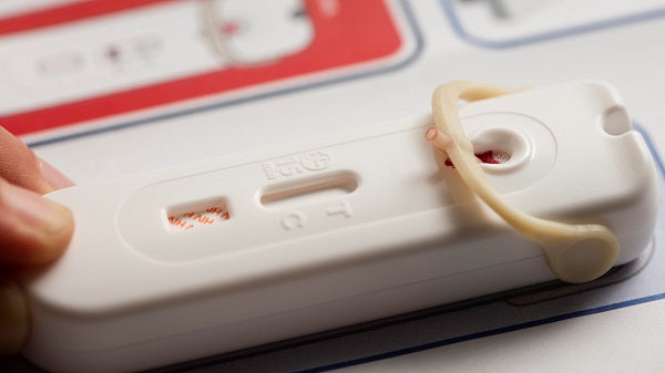 A person using a HIV test.