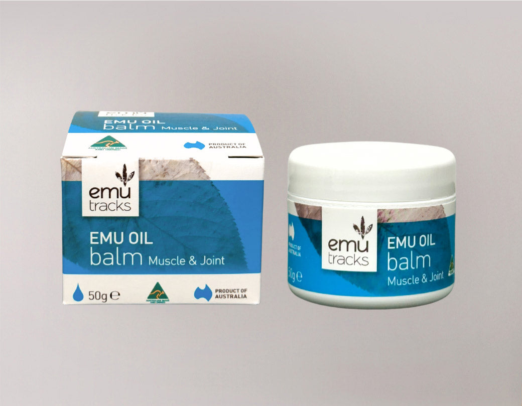 Emu oil balm packaging including jar and box on a gray background